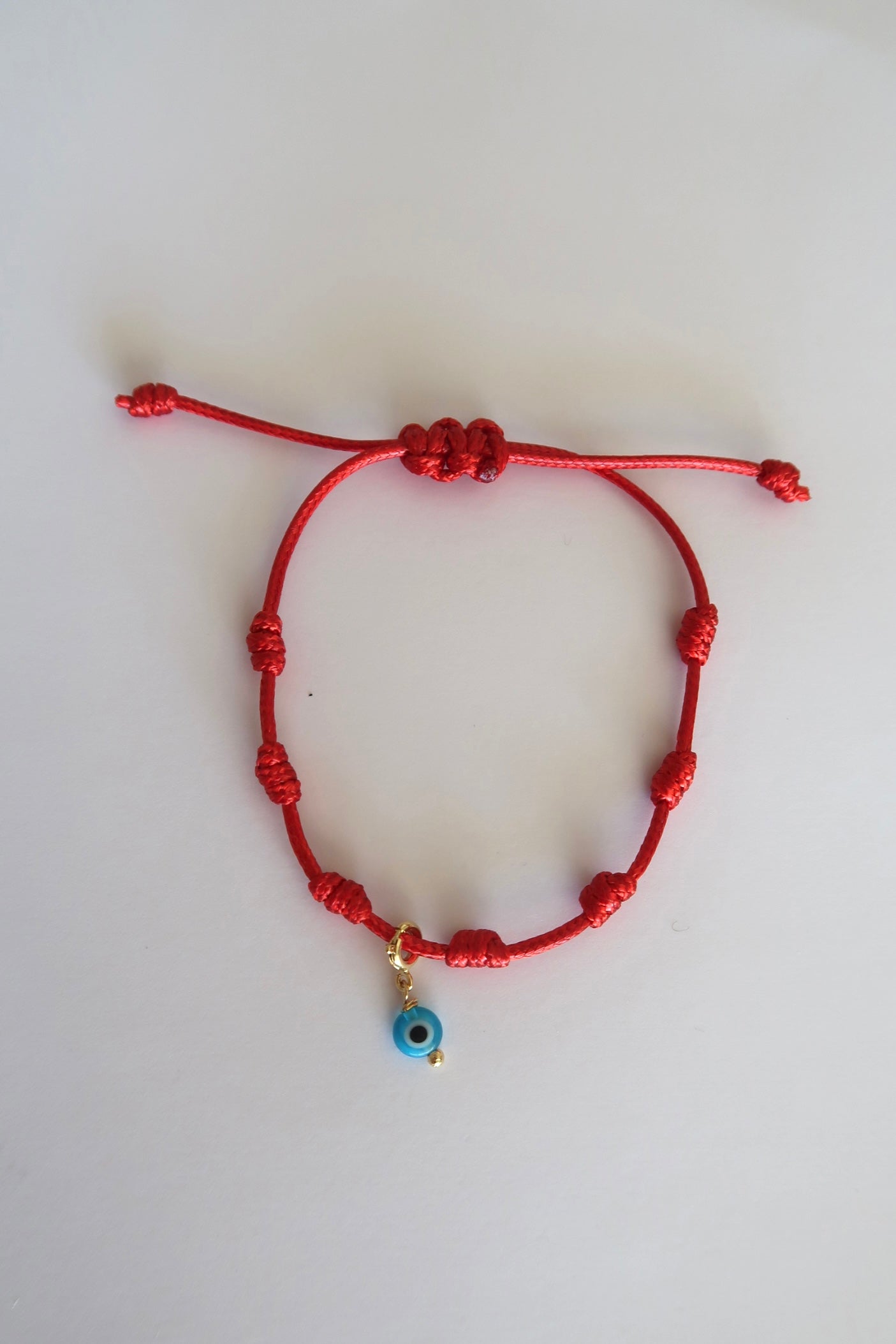 Pingente olho grego azul